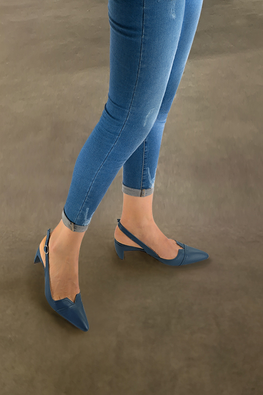 Denim blue women's slingback shoes. Tapered toe. Medium comma heels. Worn view - Florence KOOIJMAN